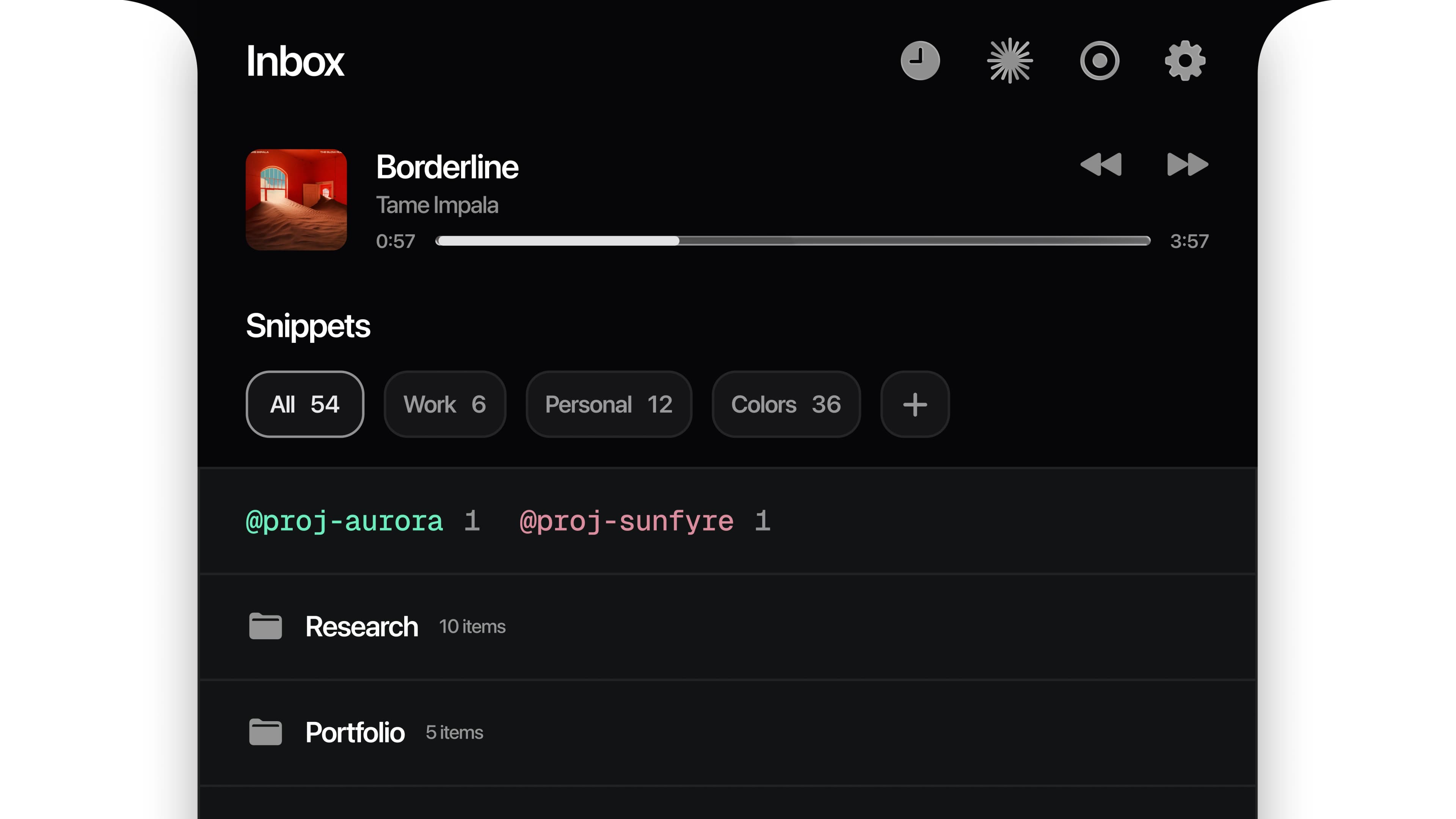 Close view of the Notch Capture inbox showing now playing, snippet categories, colored project tags, and folders.